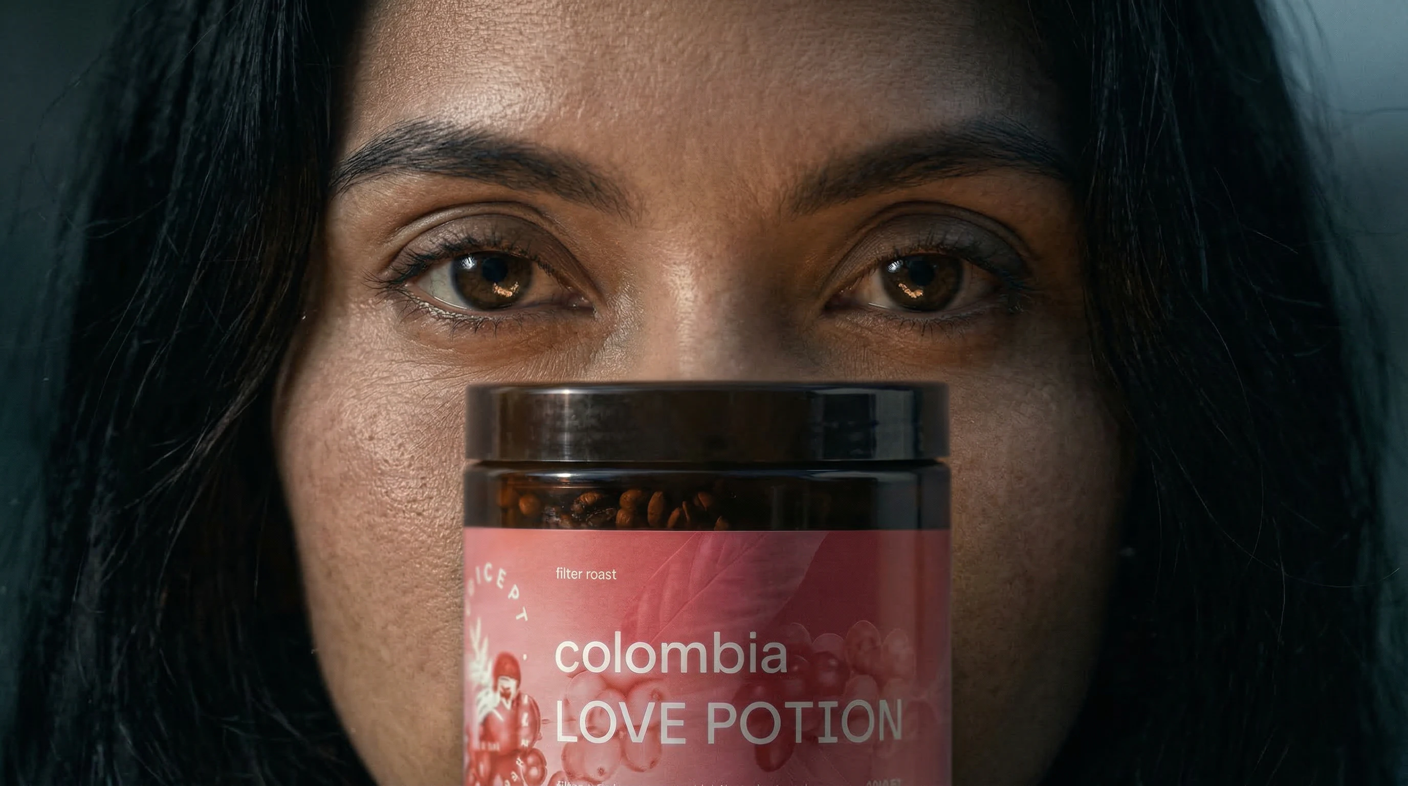 Gooseneck kettle pouring into a V60 pour-over dripper with rising steam